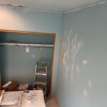 Drywall patches sanded and prepared before interior painting in a San Diego home