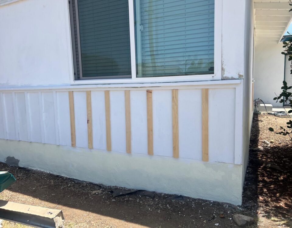New exterior wood trim installed during a localized repair before painting